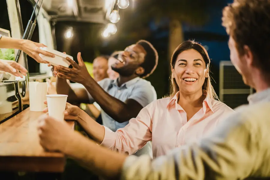 Friends laughing at the food truck